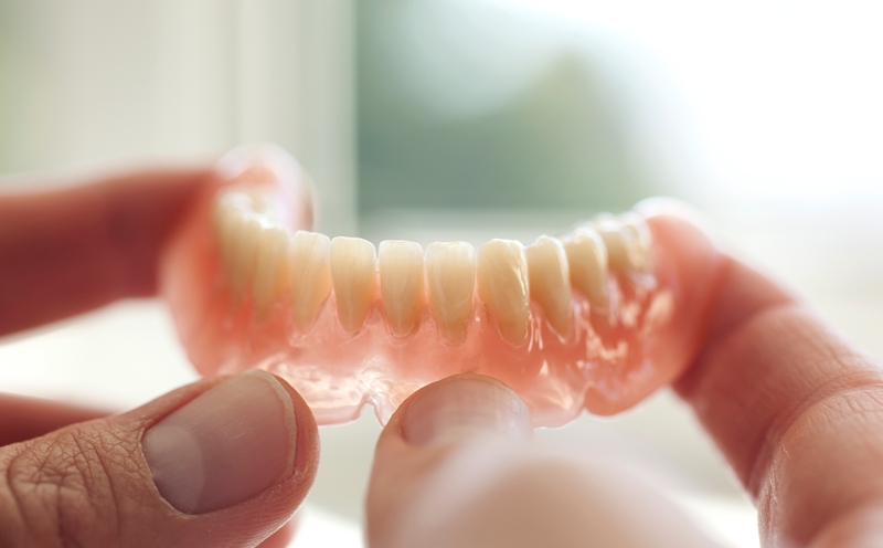 You ask, we answer: Why aren’t porcelain teeth used in dentures anymore?